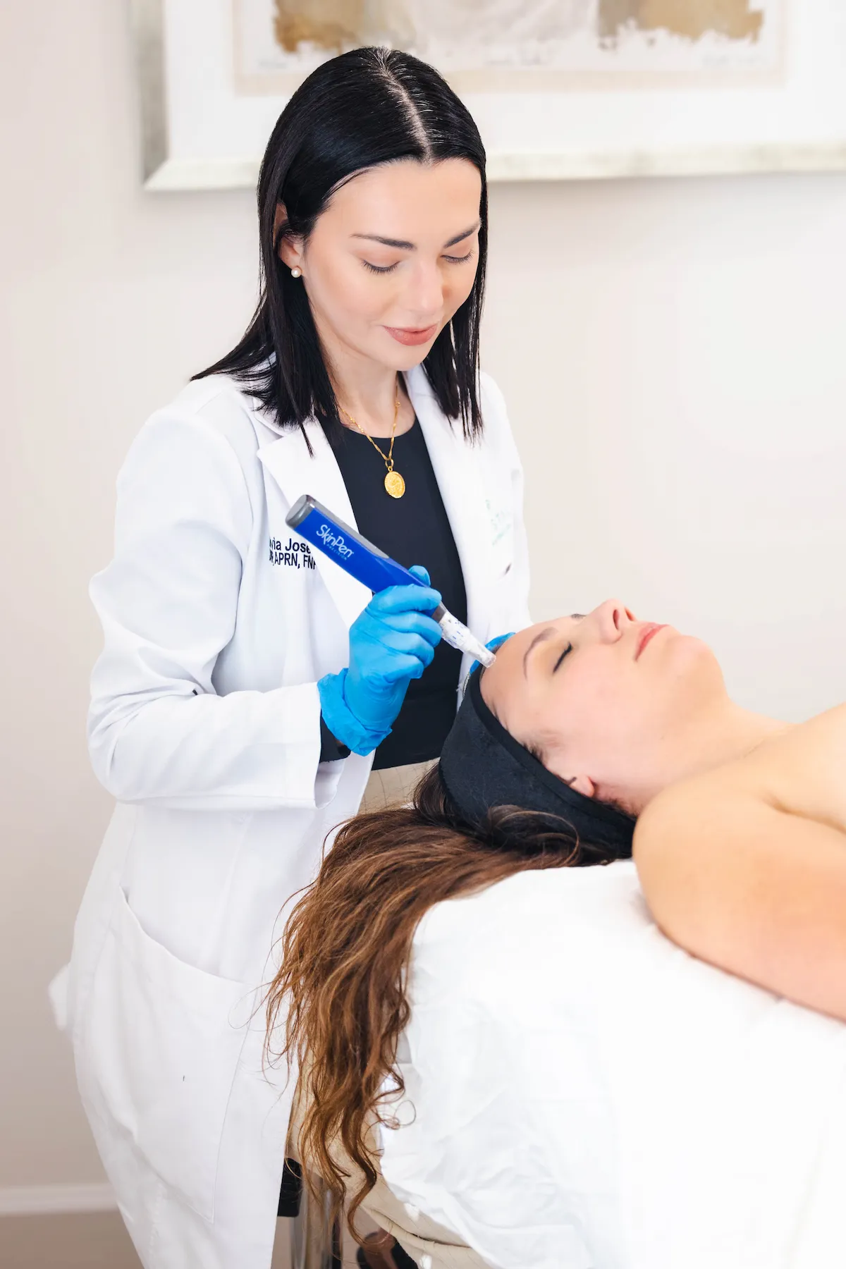 Dr. Olivia administering a SkinPen microneedling treatment at Coastal Health & Medical Spa in Jacksonville, FL