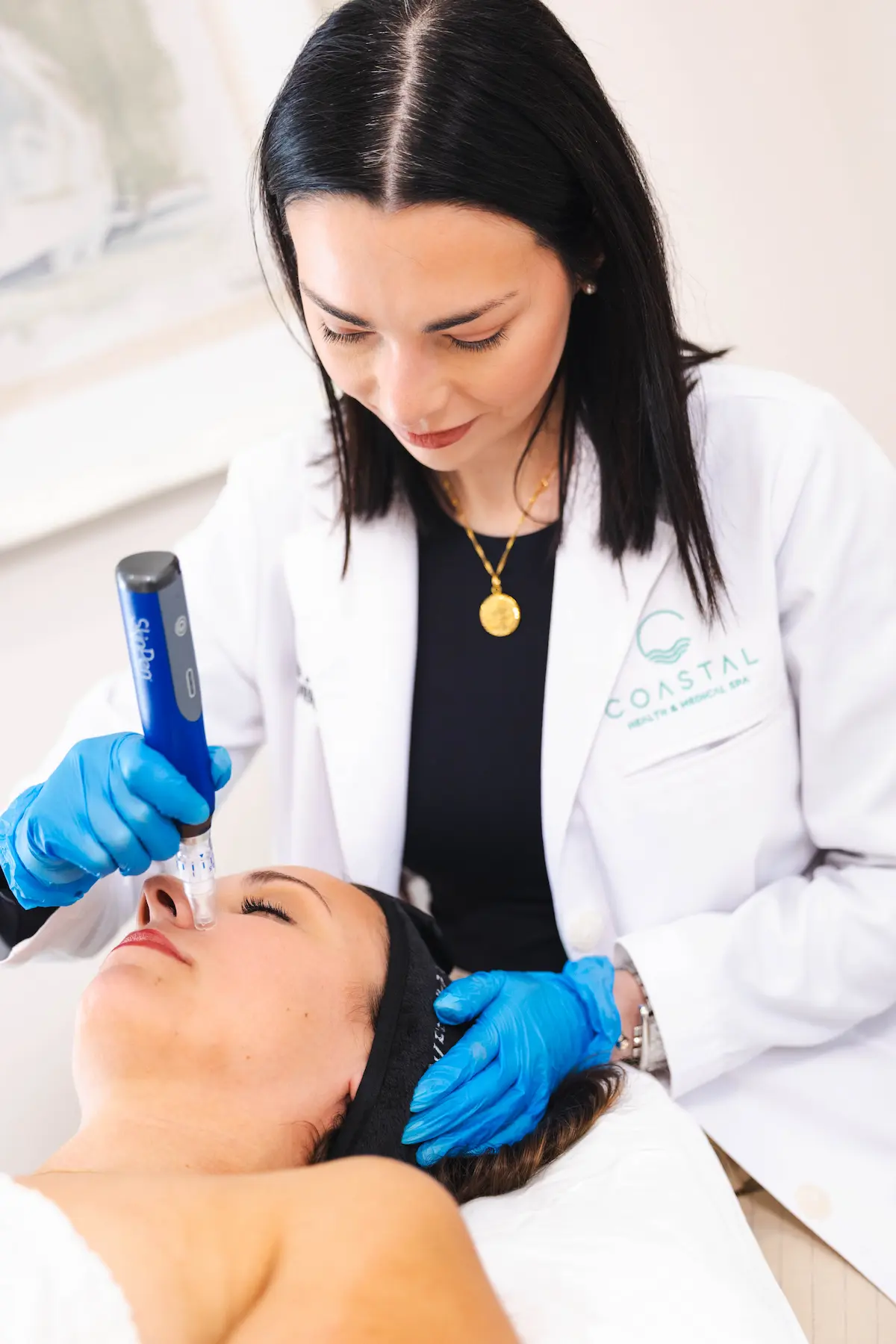 Danielle Hancock, Licensed Aesthetician at Coastal Health & Medical Spa, performing SkinPen microneedling on a young patient in Jacksonville, FL
