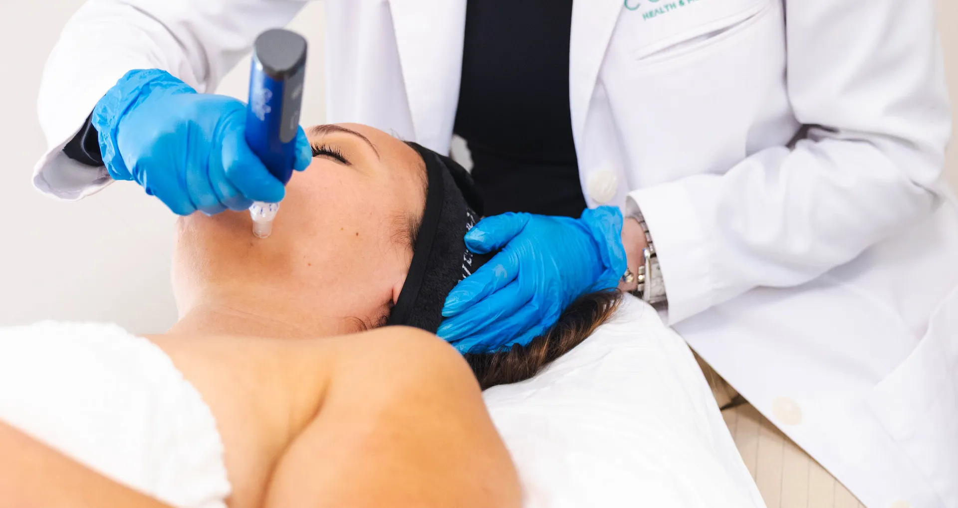 A woman receiving a SkinPen microneedling treatment at Coastal Health & Medical Spa in Jacksonville, FL