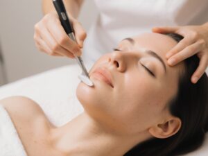 Woman getting a dermaplaning treatment at a medical spa
