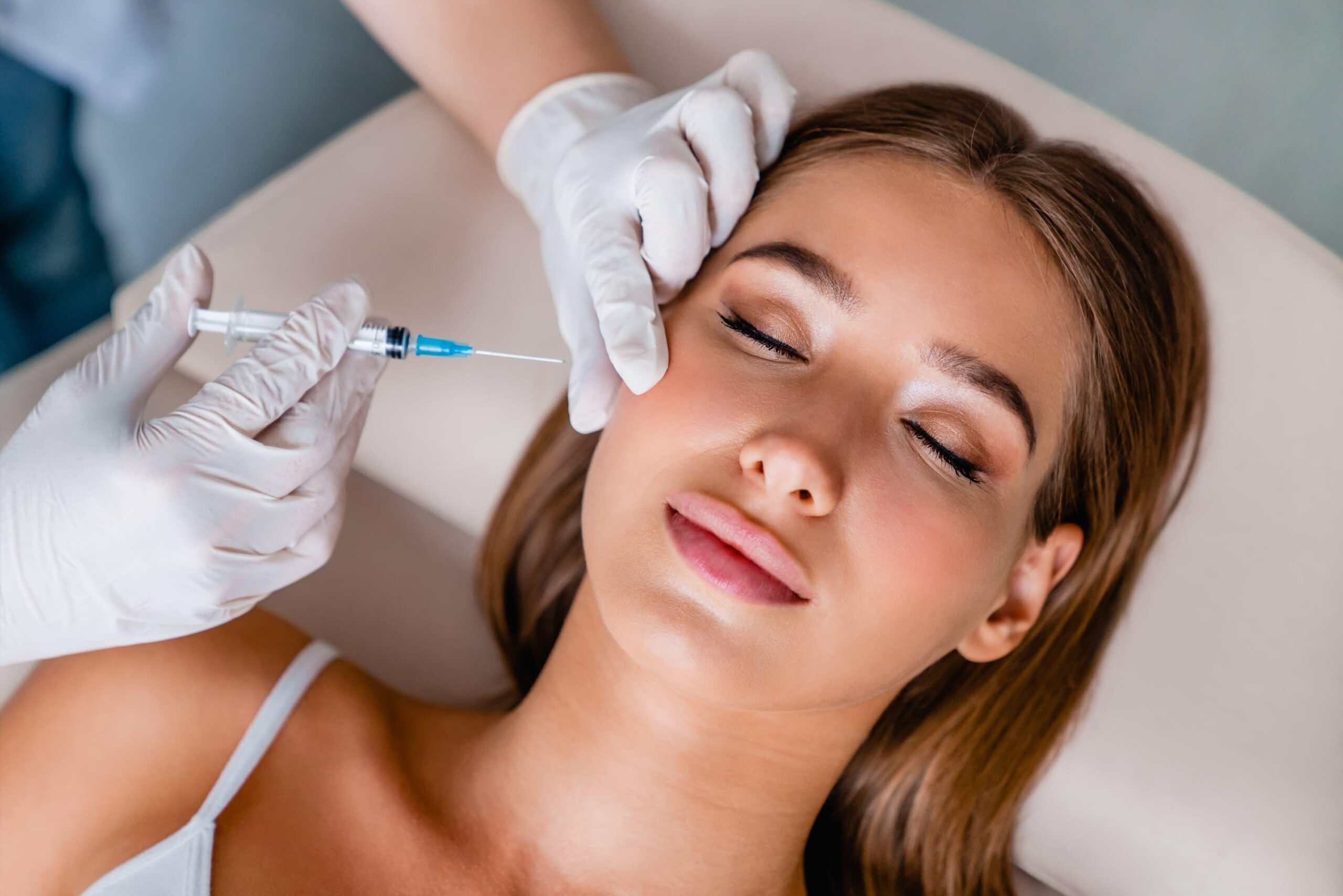 A woman getting Letybo treatment in a luxury med spa.