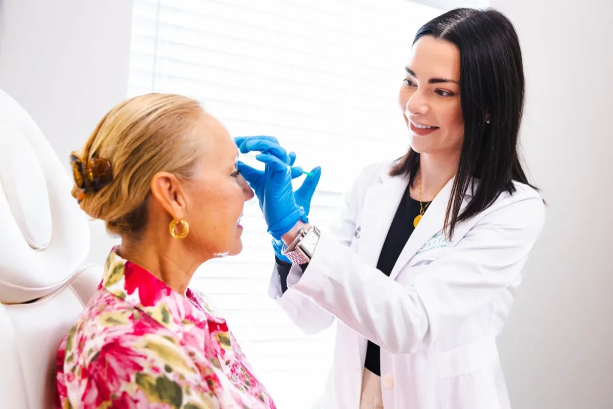 Dr. Olivia, DNP, APRN, performing an injectable treatment on a patient at Coastal Health & Medical Spa in Jacksonville, FL; Botox, filler, and laser all need their own timing window before a wedding.