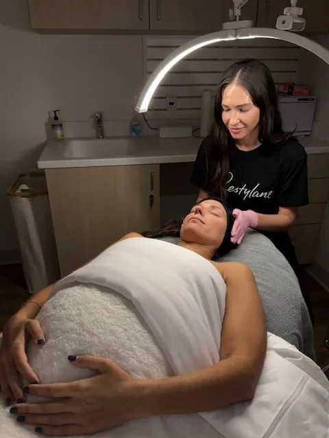 A client relaxing under the ring light during a facial at Coastal Health & Medical Spa in Jacksonville, FL