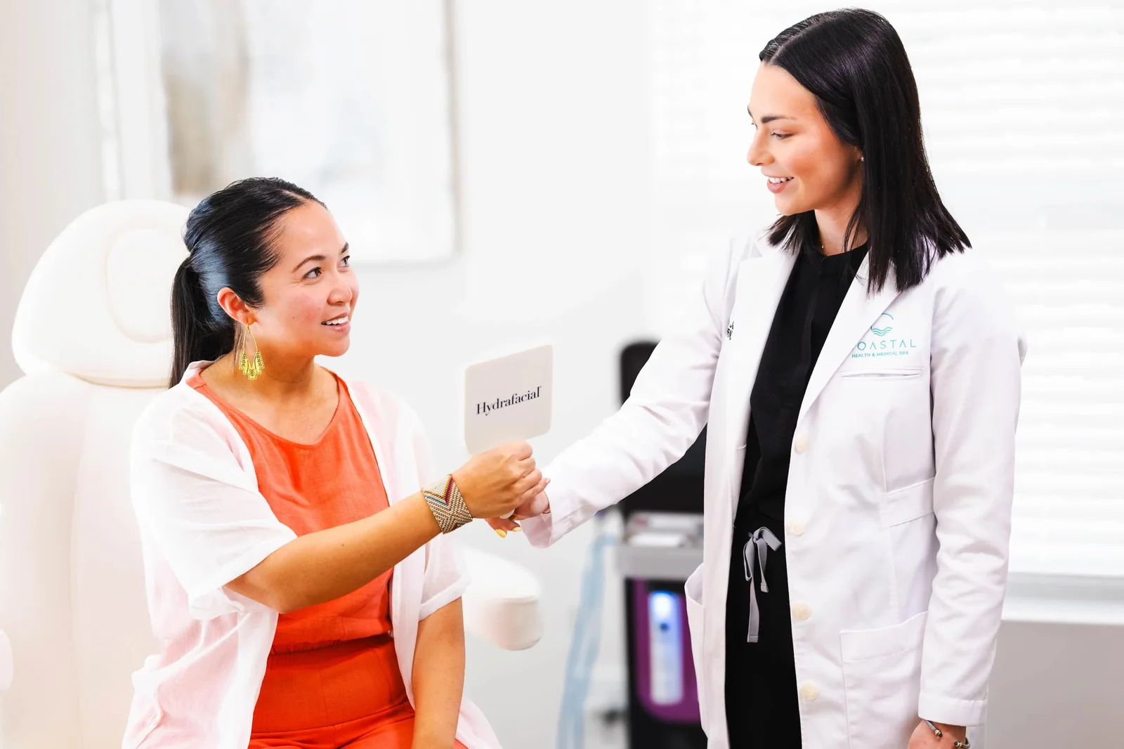 Dr. Olivia welcoming a patient back for a first-week check-in after jawline filler at Coastal Health & Medical Spa in Jacksonville