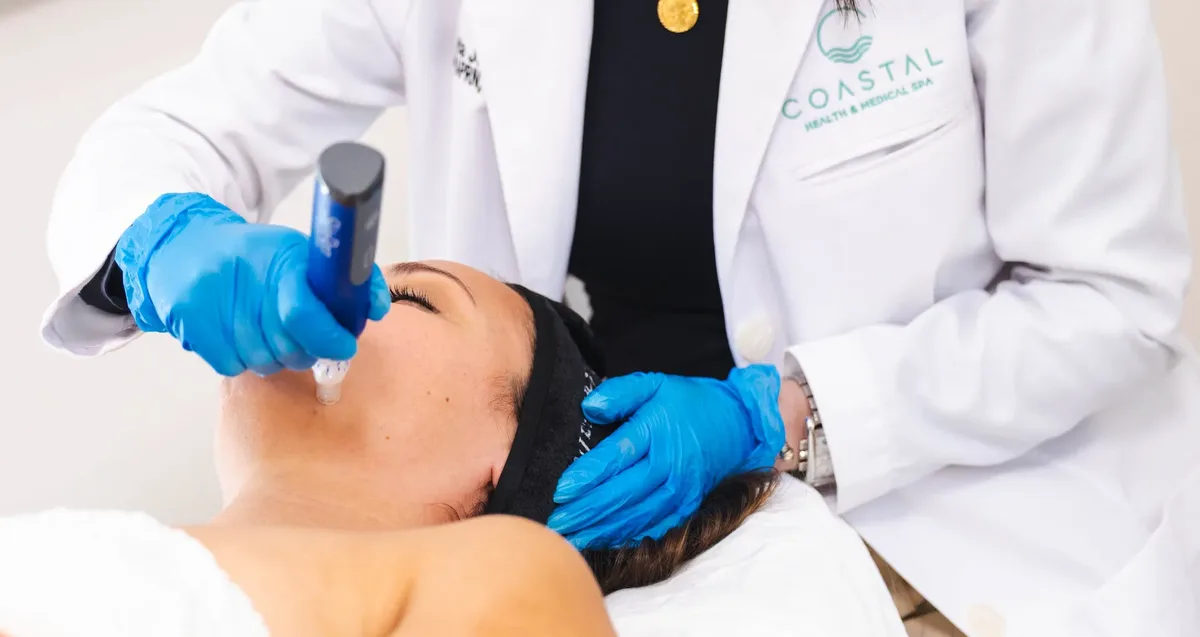 A professional SkinPen microneedling treatment in progress at Coastal Health & Medical Spa in Jacksonville, FL, with a sterile single-use cartridge on the device.