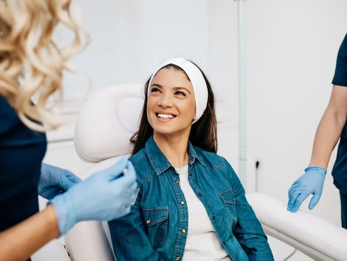 A patient settled in the treatment chair at Coastal Health & Medical Spa before her lymphatic drainage facial in Jacksonville