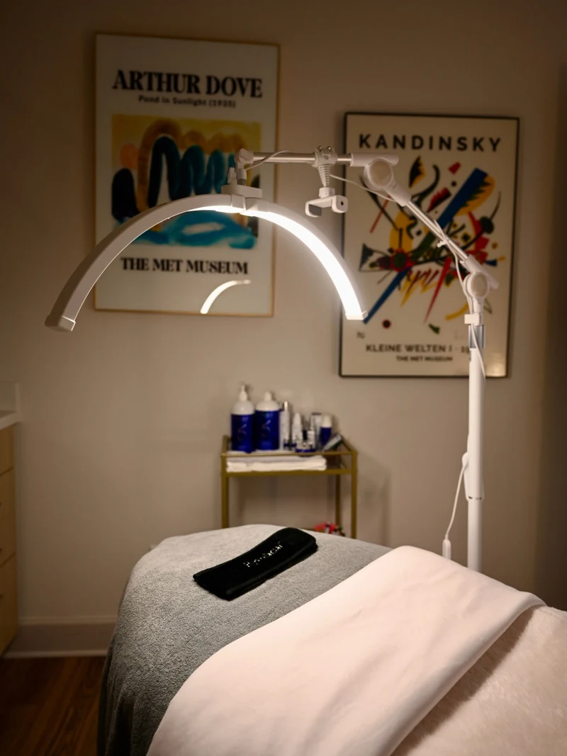 The facial treatment bed under the LED arch lamp at Coastal Health & Medical Spa in Jacksonville, where men's facials are performed