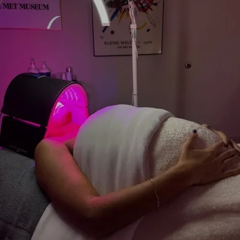 A client under the red LED light panel, the finishing step of many men's facials at Coastal Health & Medical Spa in Jacksonville, FL