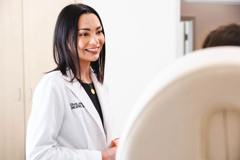 Dr. Olivia, DNP, APRN, in the treatment room before a nose filler appointment at Coastal Health & Medical Spa in Jacksonville