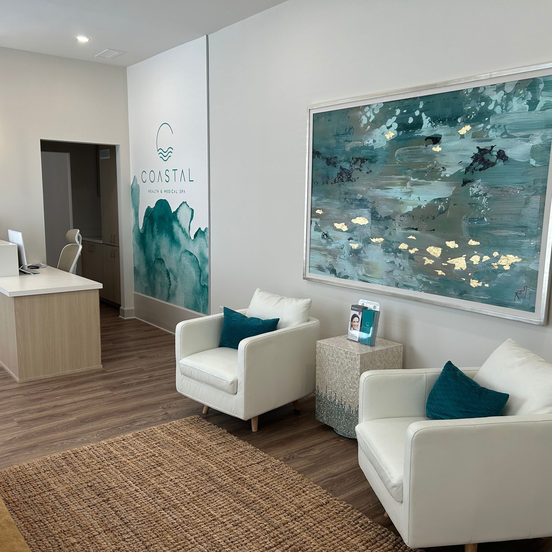 The front Lobby Coastal Health and Med Spa in Jacksonville, Fl with a brown and teal interior & a "coastal", relaxing atmosphere